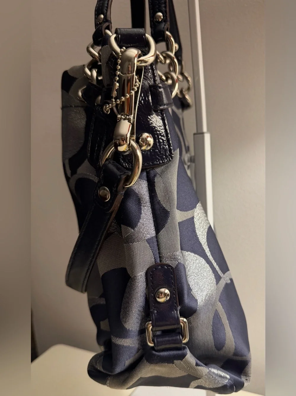 Coach navy , gray & metallic silver signature jacquard with navy leather trim.